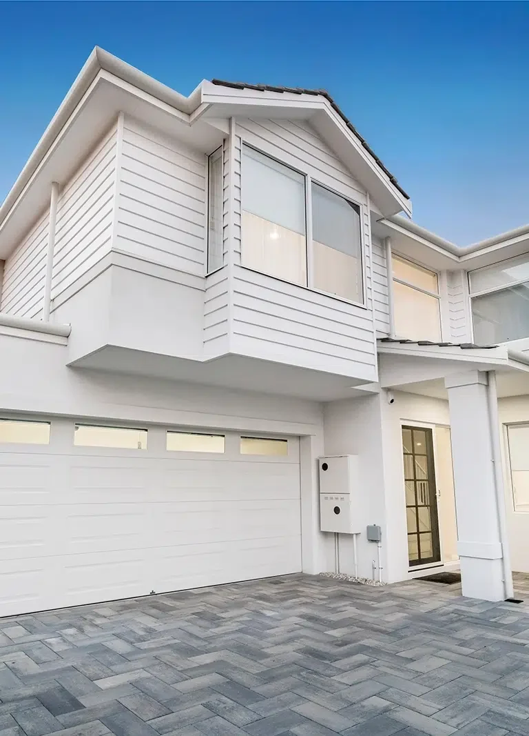 Exterior-House-Painting-Central-Coast-PTM-1.webp A large white home with freshly painted by Coast of Paint, Residential Exterior Painters on the Central Coast, NSW