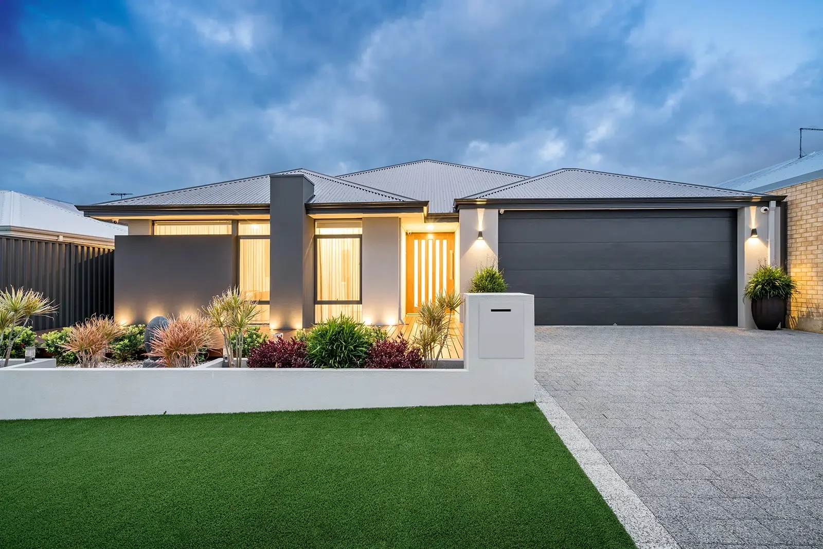 Exterior-Maintenance-Painting-Central-Coast-LS-1.webp A modern single storey home has exterior maintenance painting to keep it in top condition