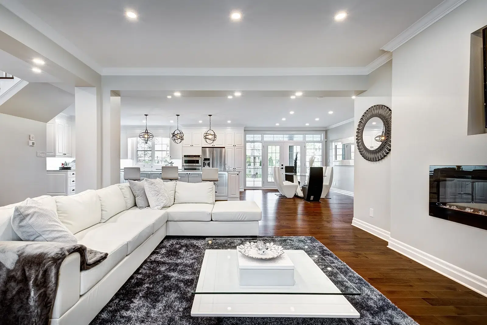 Painting-Services-On-The-Central-Coast-NSW-LS-1.webp A large living room with white walls, by Coast of Paint, providing Painting Services on the Central Coast NSW